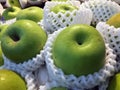 Pile of green apple in the white Fruit Packaging Foam Net.